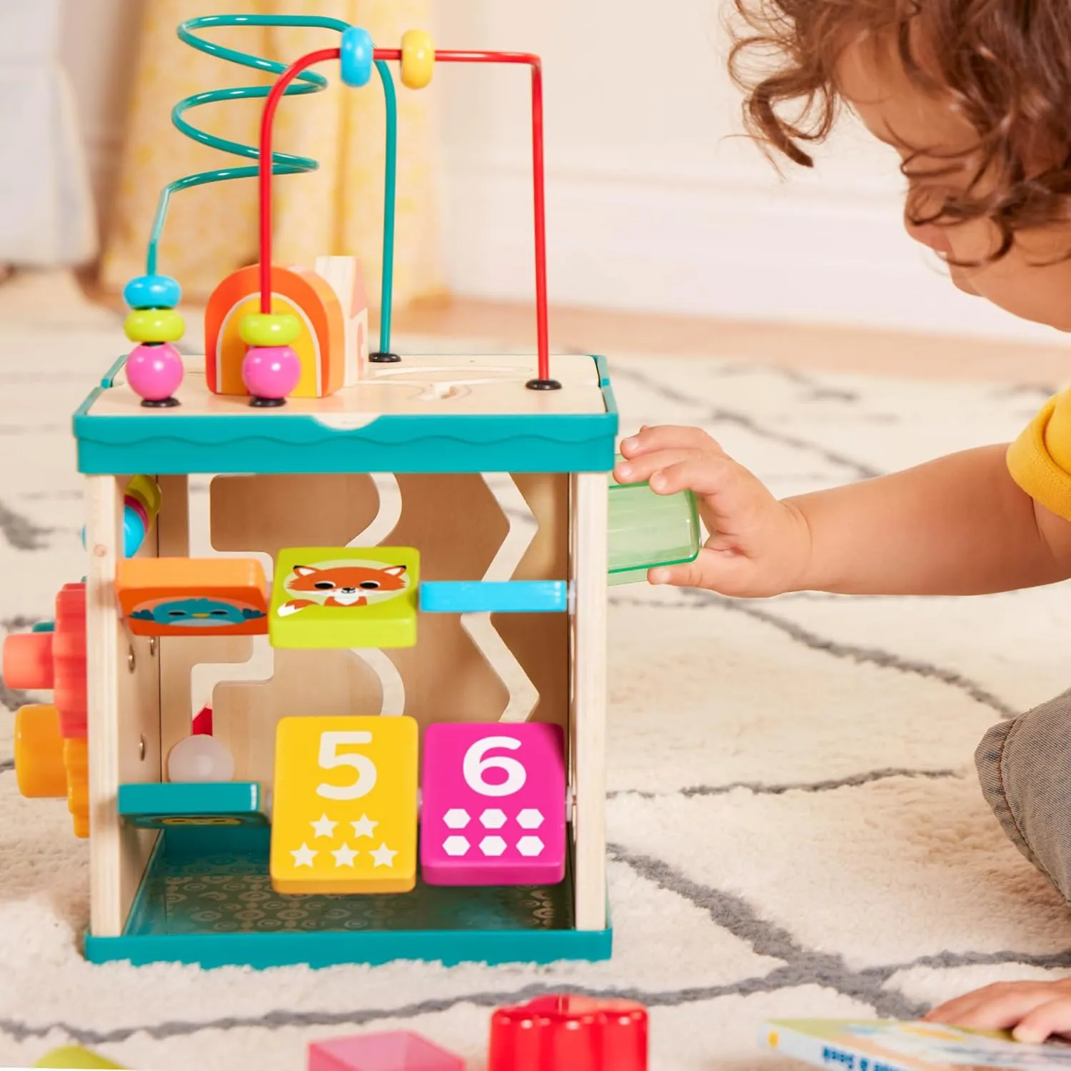 B. toys – Tabletop Activity Cube – Educational Storybook Included – Wooden Shape Sorter, Bead Maze, Animal Tiles – Top Flips for Compact Storage – 12 Months   – Lil' Learning Cube
