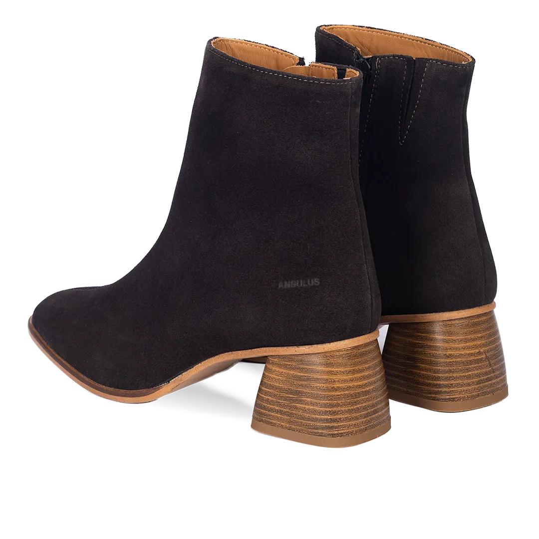 Boot with sculptural wooden heel