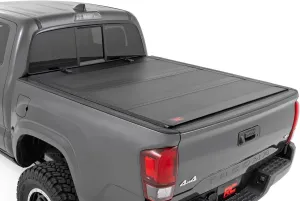 Rough Country Hard Tri-Fold Flip Up Truck Bed Tonneau Cover for Toyota Tacoma (2016-2023) - Flush Aluminum Bed Cover, Fits 5' (60.5") Bed